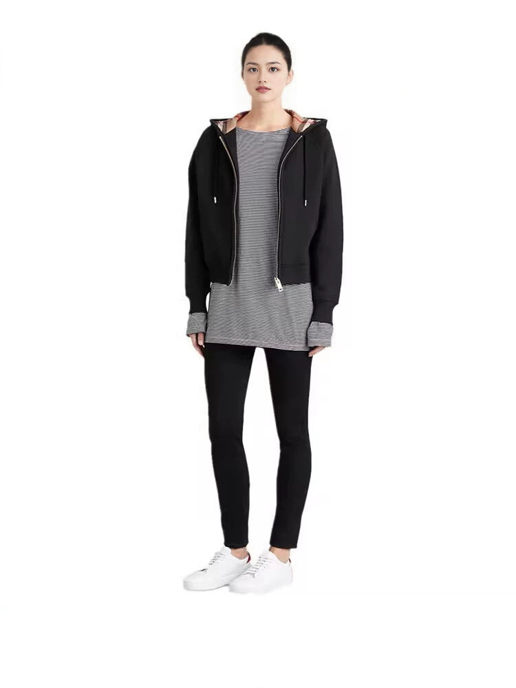 Black hooded zip-up sweatshirt jacket with front zipper and drawstrings, model wear.