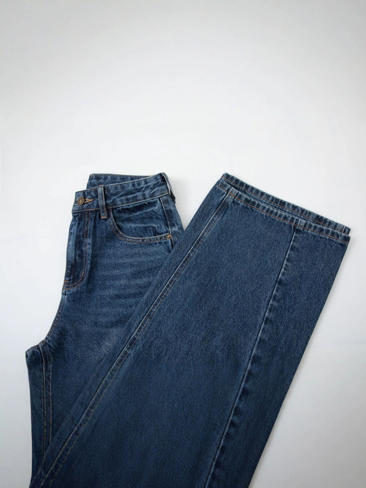 Women's dark blue wide-leg denim jeans, laid flat front view, full-length trouser fit
