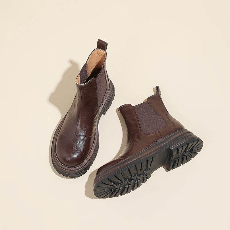 Brown leather platform Chelsea boots with lug sole tread and chunky block heel