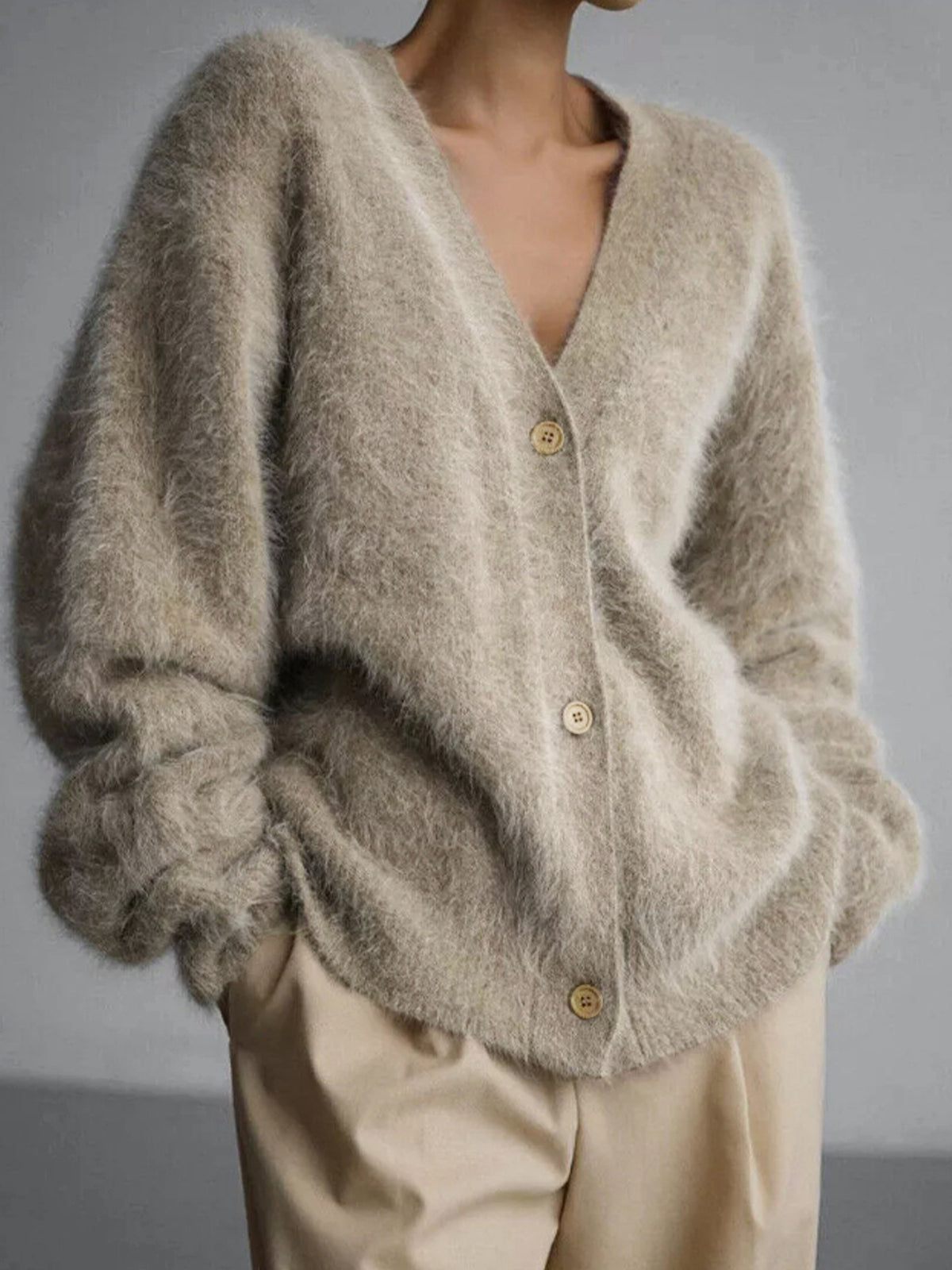 Fuzzy knit cardigan with V-neck, long sleeves, and button front, light khaki