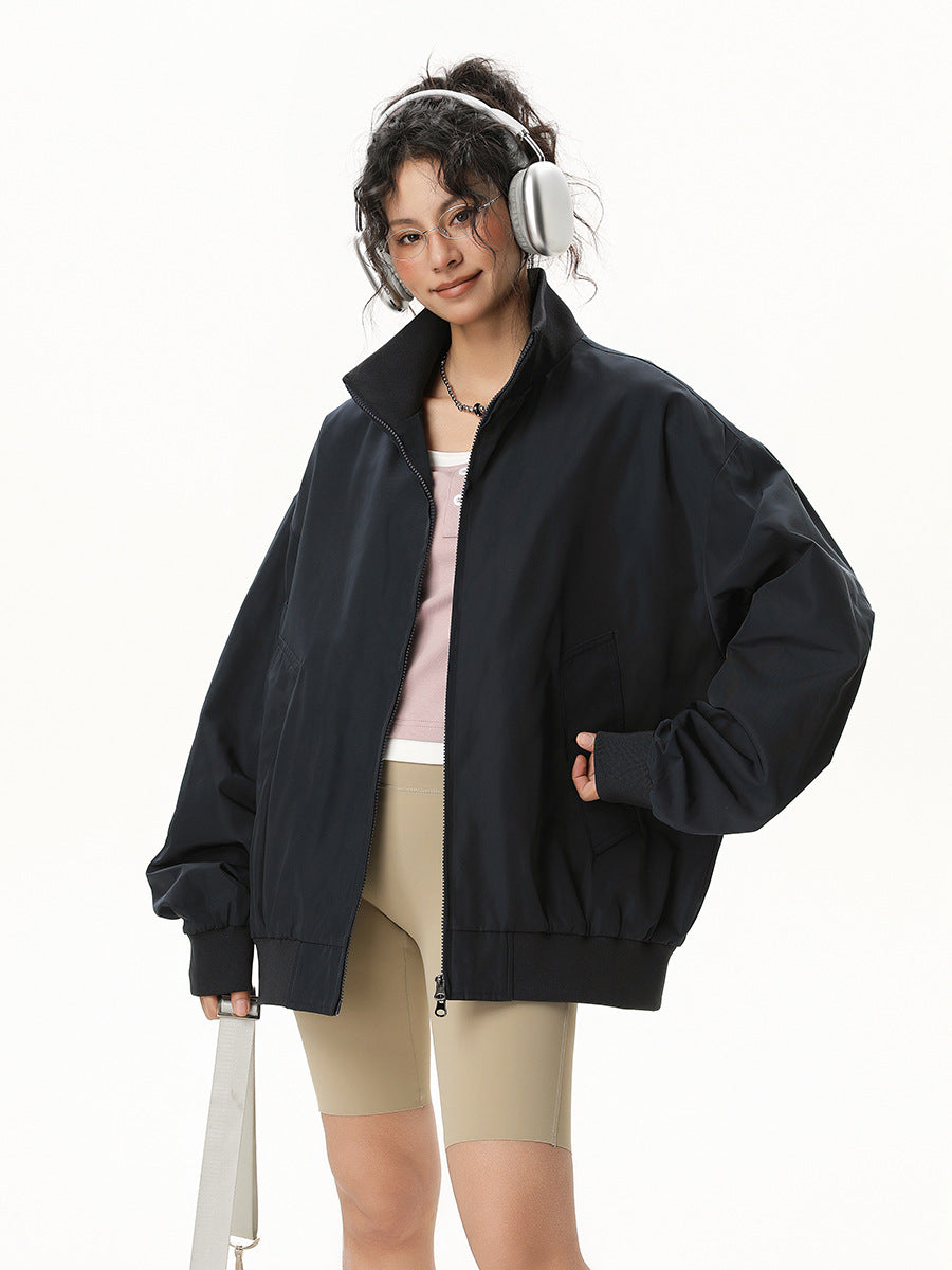 Black bomber jacket with zip front, stand collar, ribbed cuffs and hem, long sleeves.