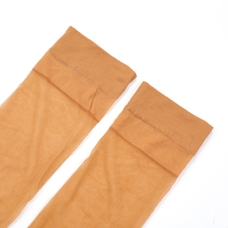 Women's ultra-thin sheer thigh-high stockings, folded close-up, skin-tone orange