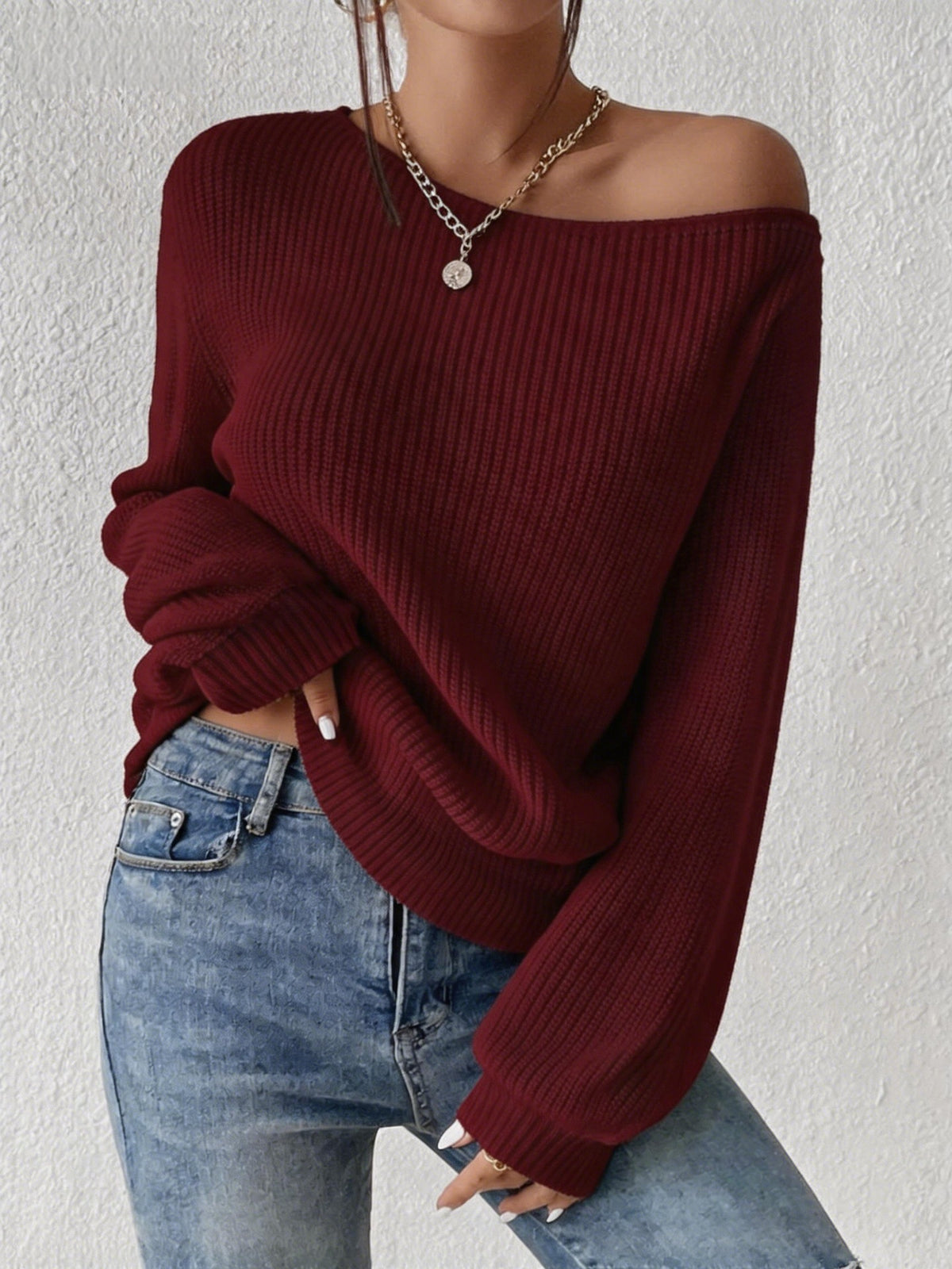 Burgundy one-shoulder off-the-shoulder knit sweater, loose long sleeves, solid color.