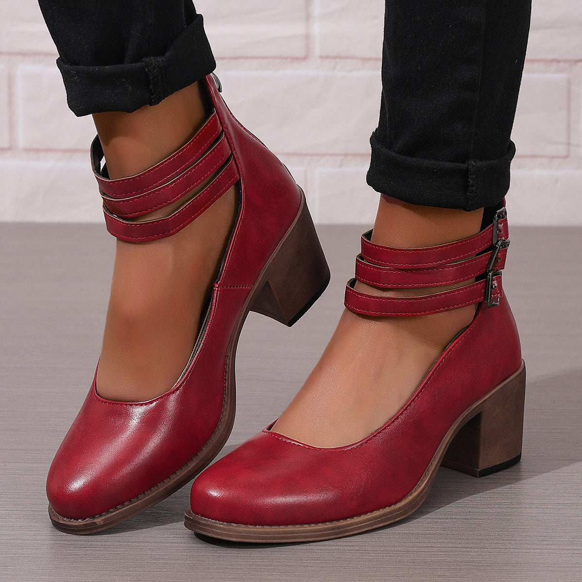 Red ankle boots with stacked heel and double ankle strap buckles