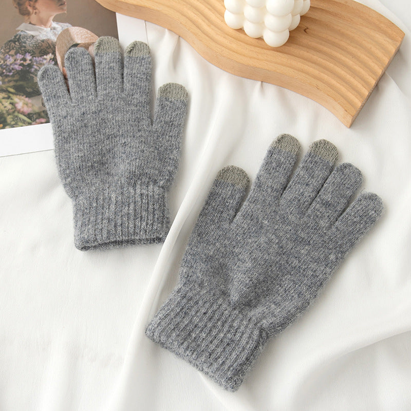 Gray knit gloves with lighter gray fingertips and ribbed cuffs