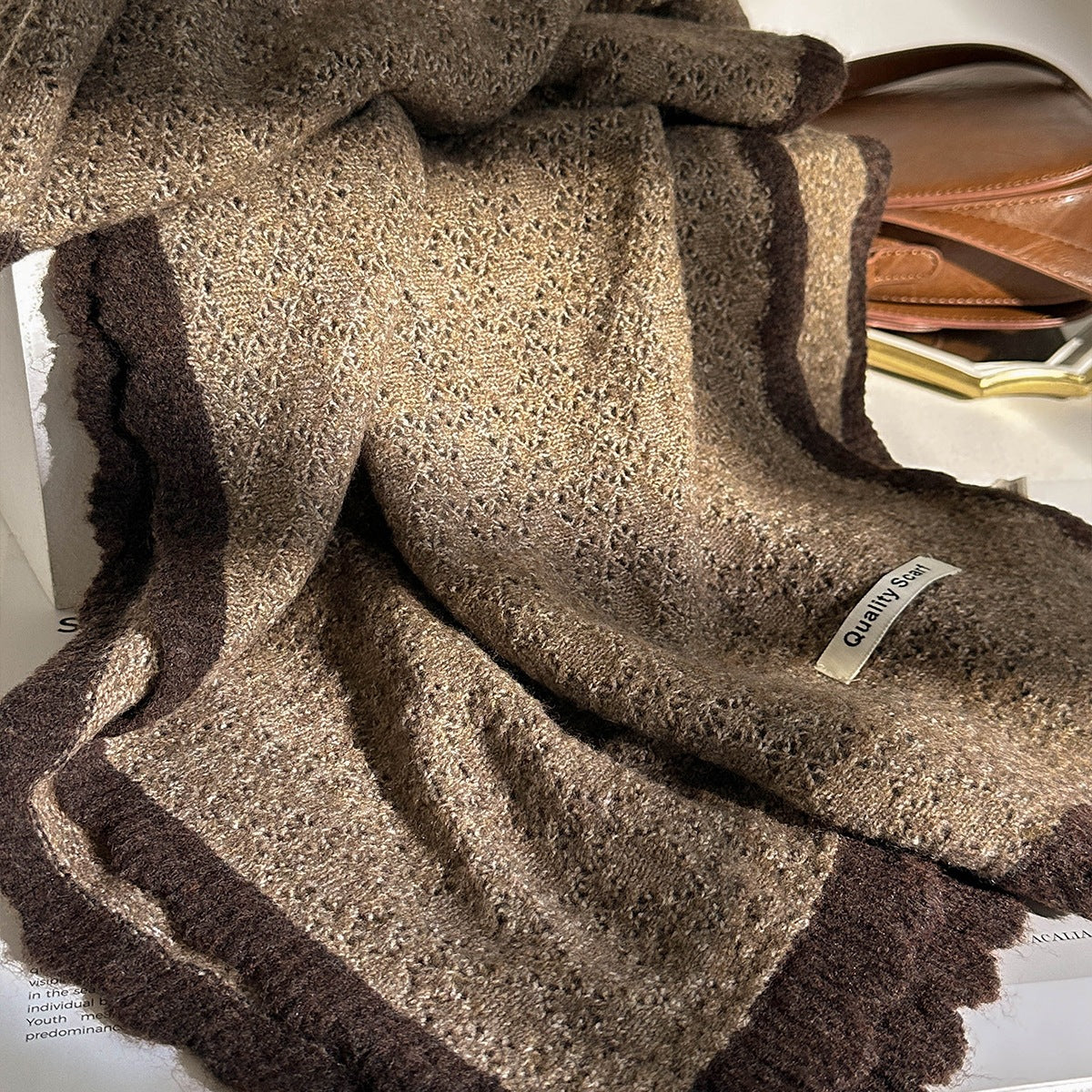 Coffee-brown lace-knit wool scarf with darker stripe border and fringed edge.