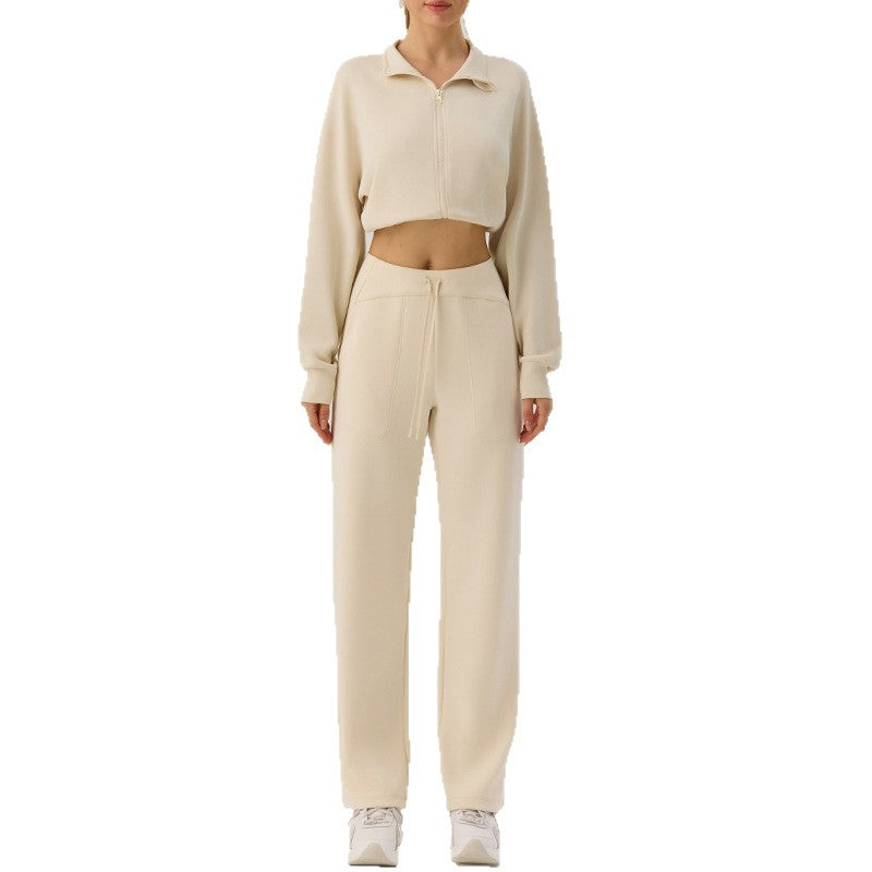 Beige zip-up stand-up collar cardigan with loose lantern sleeves and cropped hem, front view.