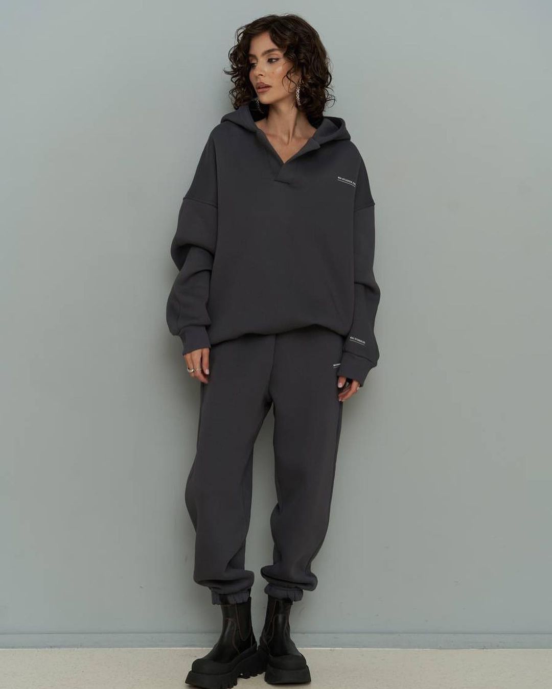 Dark gray hooded sweatshirt and matching jogger pants set with front pocket
