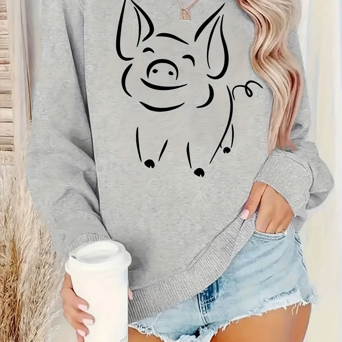 Gray women’s pullover hoodie with large smiling cat face print