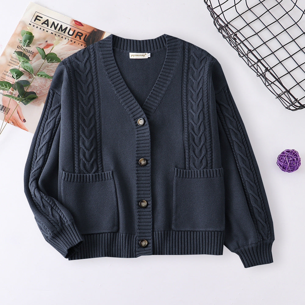 Women’s cable knit cardigan in dark blue with V-neck button front and patch pockets