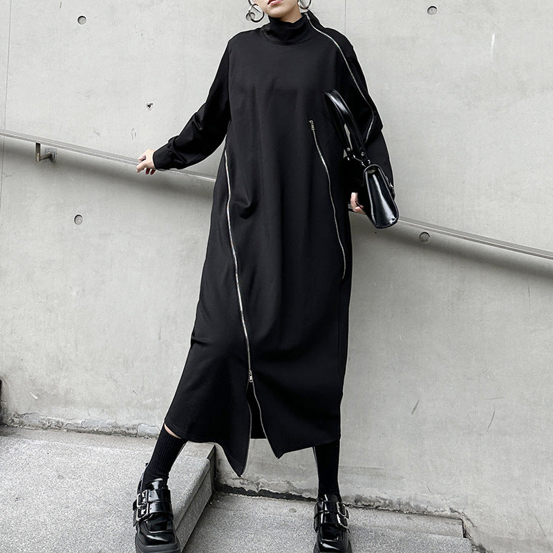 Black knit midi dress with funnel neck, long sleeves, asymmetrical zip seam and side slit