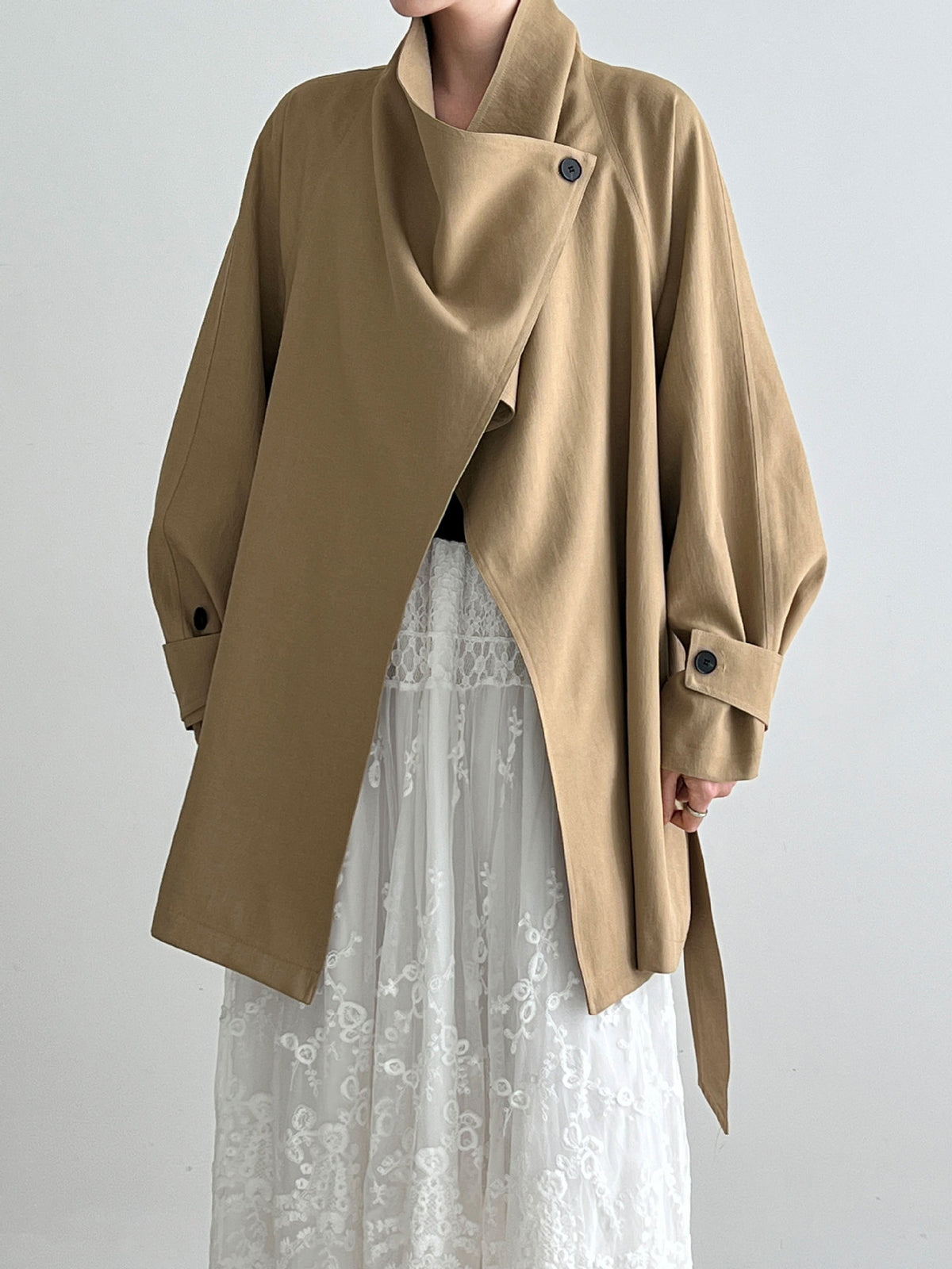 Women’s khaki wrap coat with large lapel and draped front overlay, button cuffs