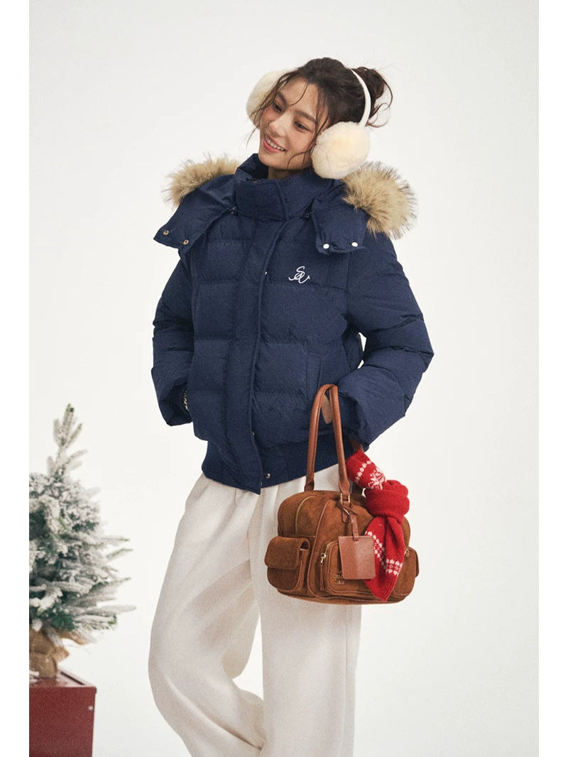 Women's navy hooded puffer jacket with faux-fur trim, zip front and side pockets