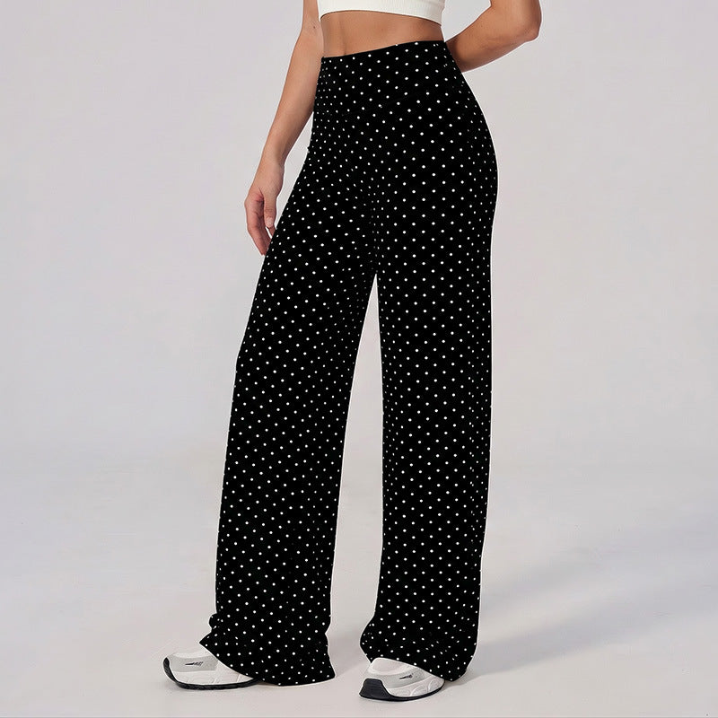 Wide-leg pants in black with white polka dots, high-rise waistband