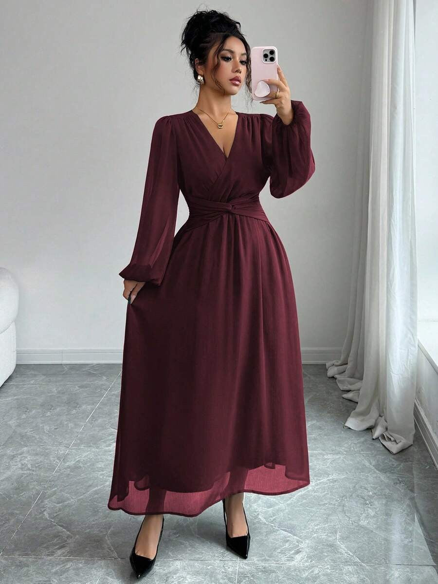 Wine red chiffon maxi dress with long sleeves, wrap front, cinched waist.