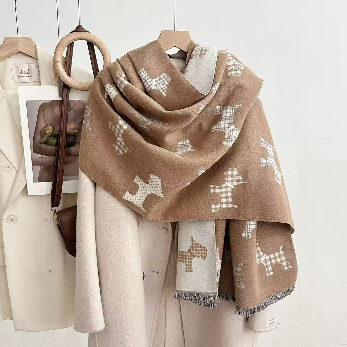Tan shawl with patterned dog motifs and fringed ends
