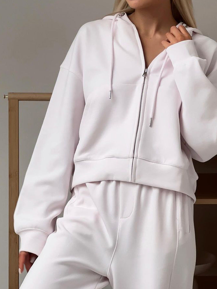 Women's white zip-hooded sports cardigan and matching jogger pants set