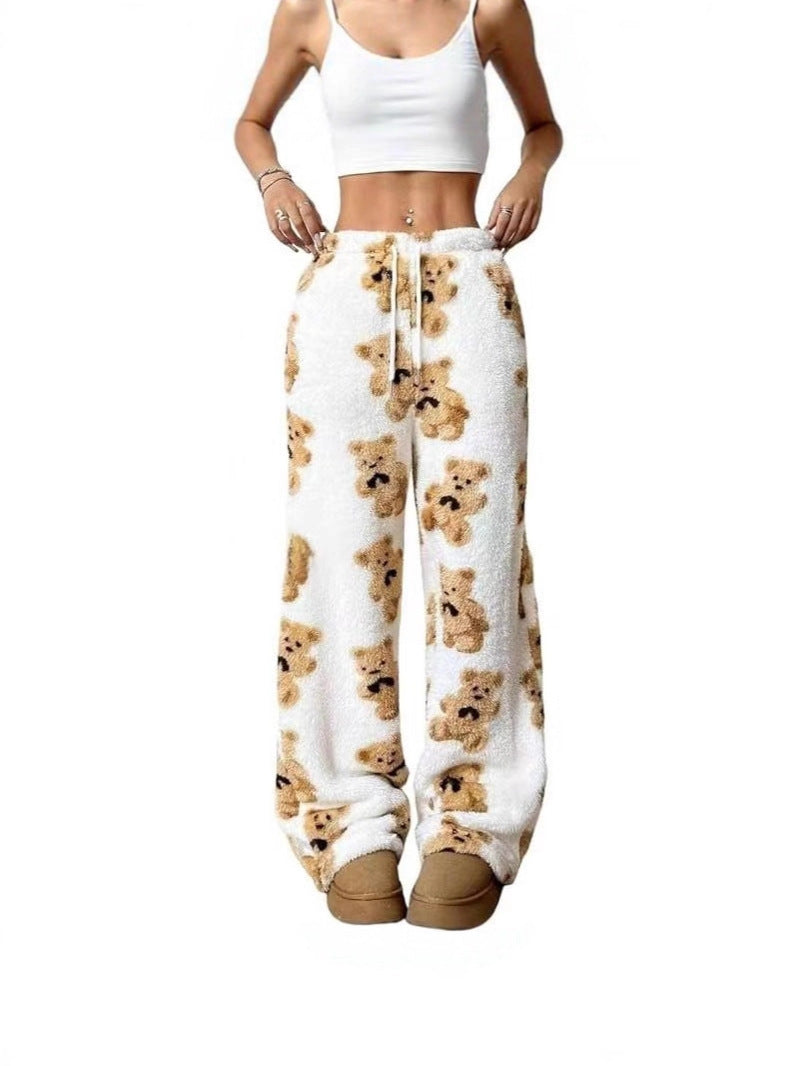 Loose fleece pants with white base and teddy bear print, drawstring waist