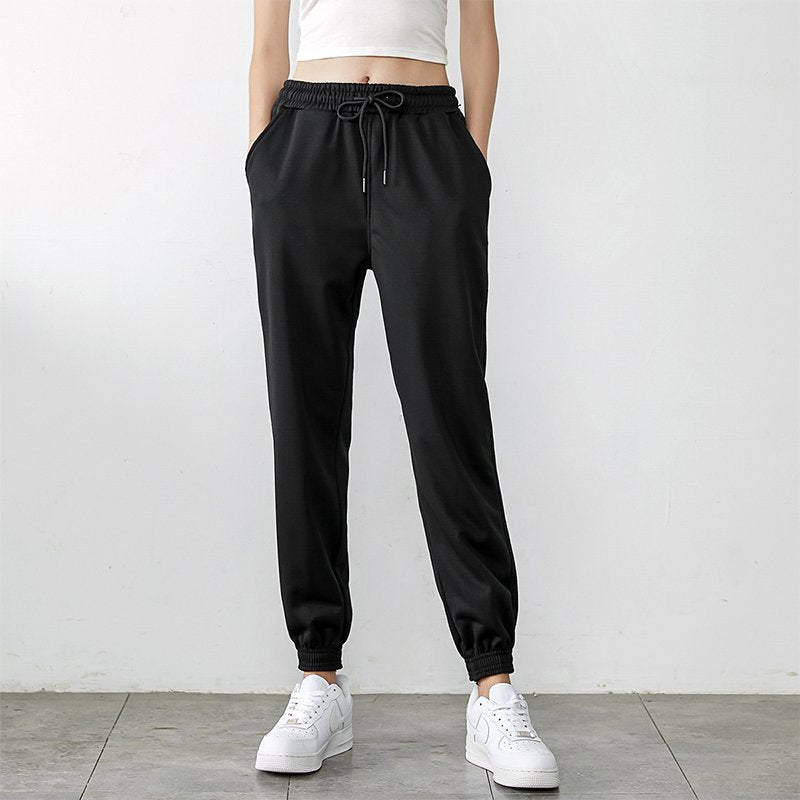 Black high-waisted jogger sweatpants with drawstring and elastic ankle cuffs