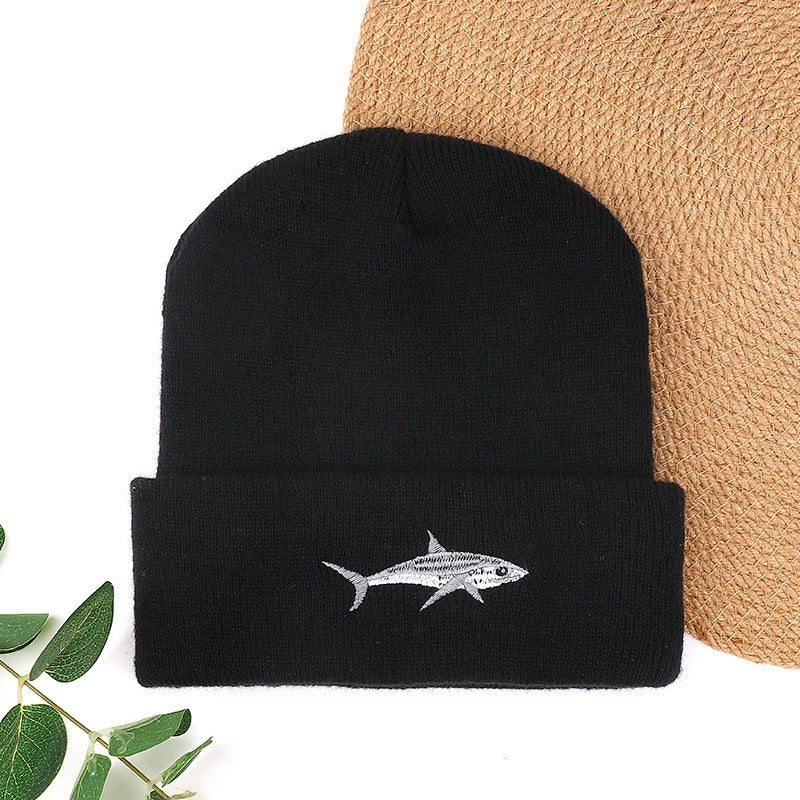 Black knit beanie with white shark embroidery