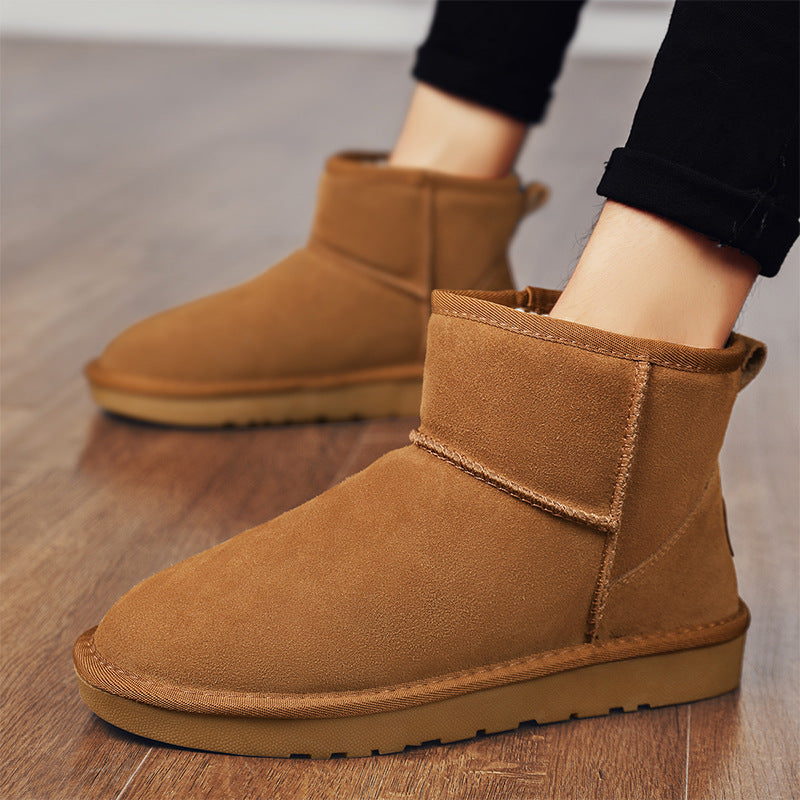 Brown winter ankle boots with plush fur lining and low-profile rubber sole