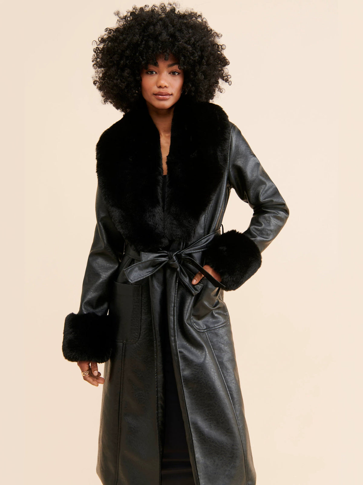 Black long coat with faux fur trim and leather-look body, wrap belt at waist