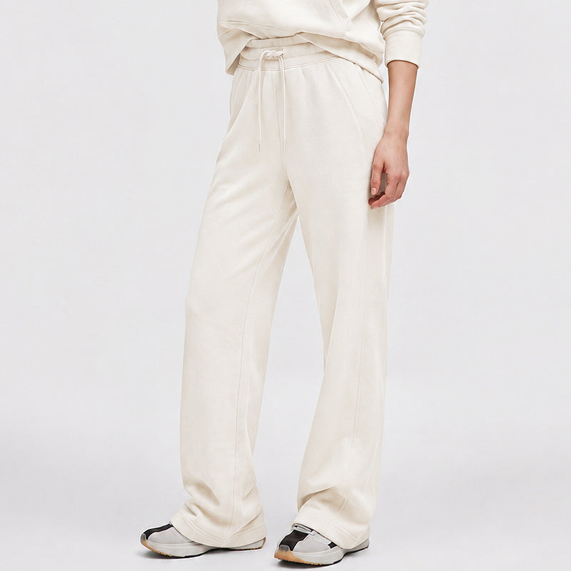 Fleece-lined wide-leg pants in cream, mid-waist drawstring, loose straight wide legs