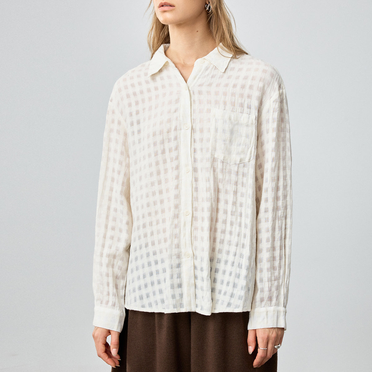 Off-white plaid long-sleeve collared button shirt, relaxed fit, textured fabric
