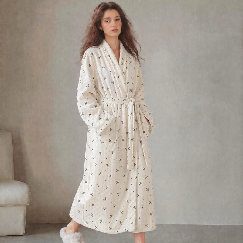 White patterned long flannel bathrobe with shawl collar and tie belt