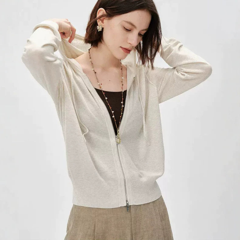 Light beige zip-front knit cardigan with long sleeves and V-neck