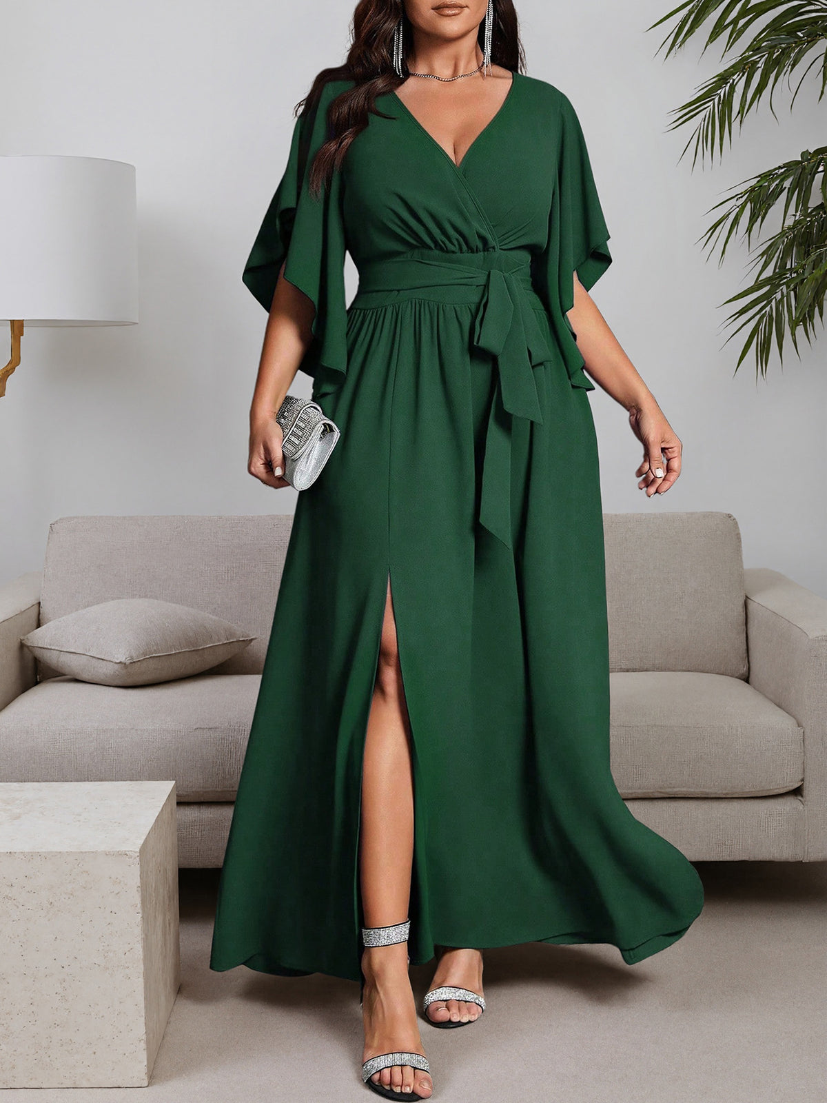 Green plus-size maxi dress with V-neck, tie waist, side slit, ruffled flutter sleeves