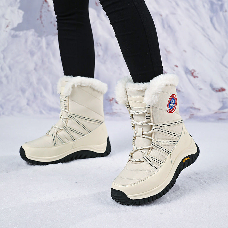 Women’s snow boots, white high-top pair with faux-fur cuffs and lace-up detail