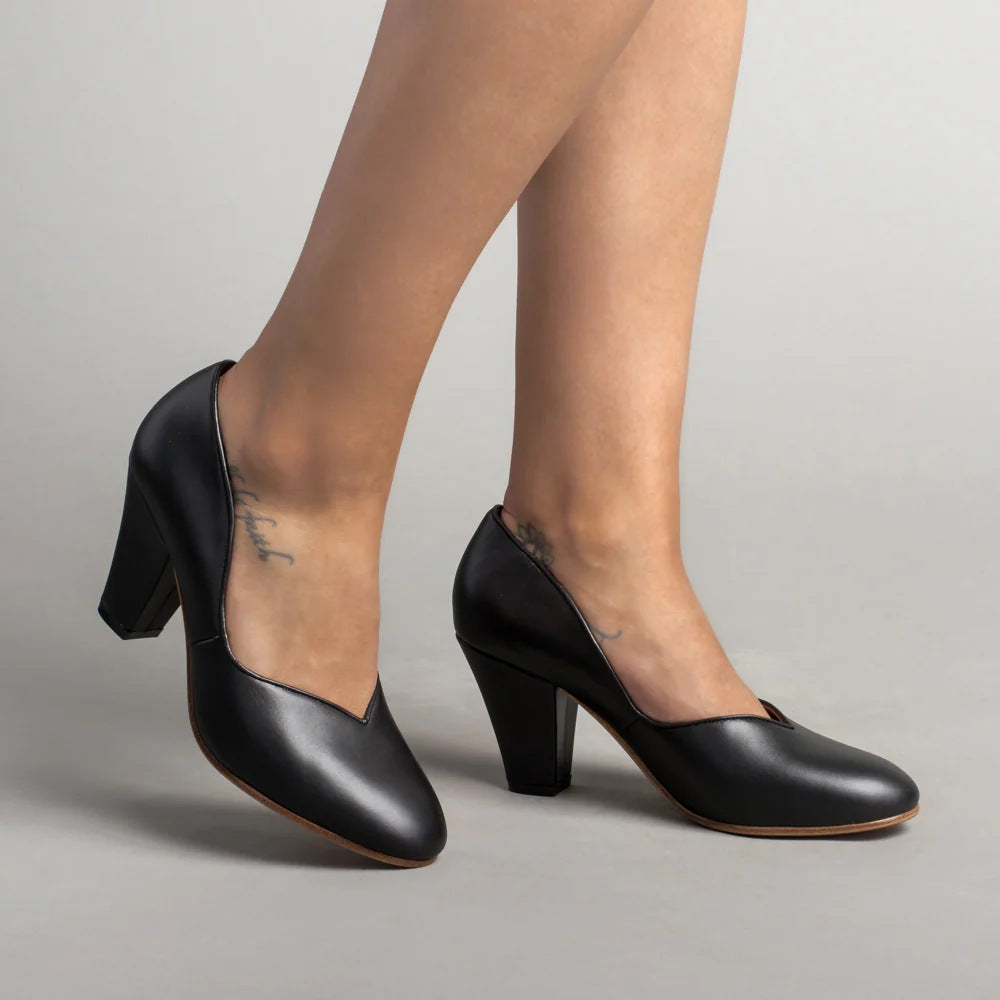 Black women's pumps with a shallow V-cut topline and block heels