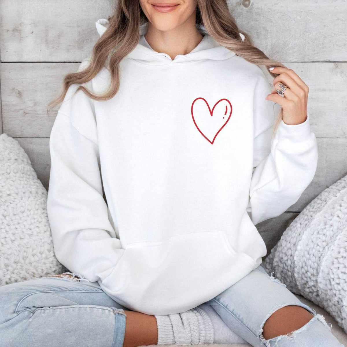 White minimalist heart hoodie with red outlined heart on the chest