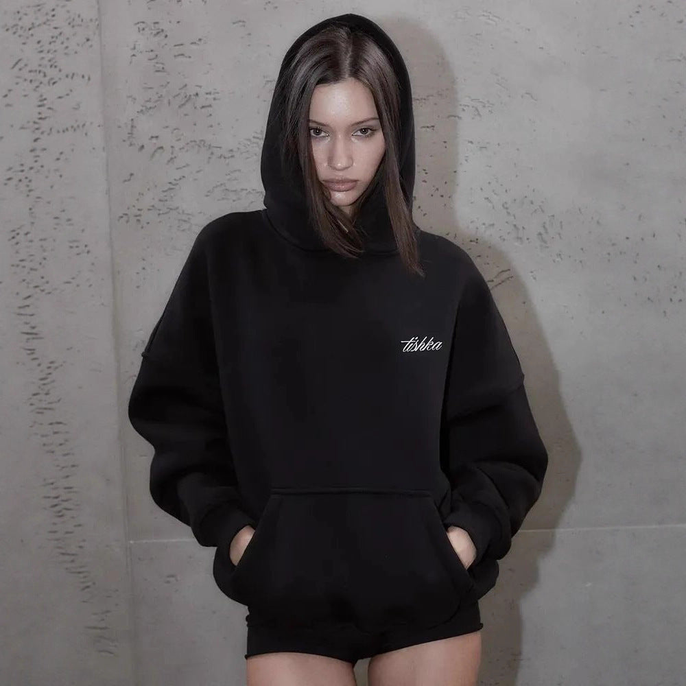 Black women's hoodie with small chest lettering, kangaroo pocket and oversized hood