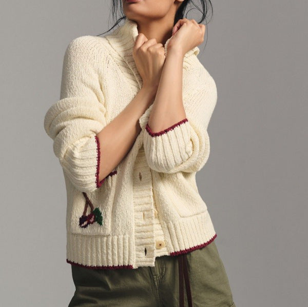 Beige cardigan sweater coat, button front, ribbed cuffs and hem with embroidered motifs