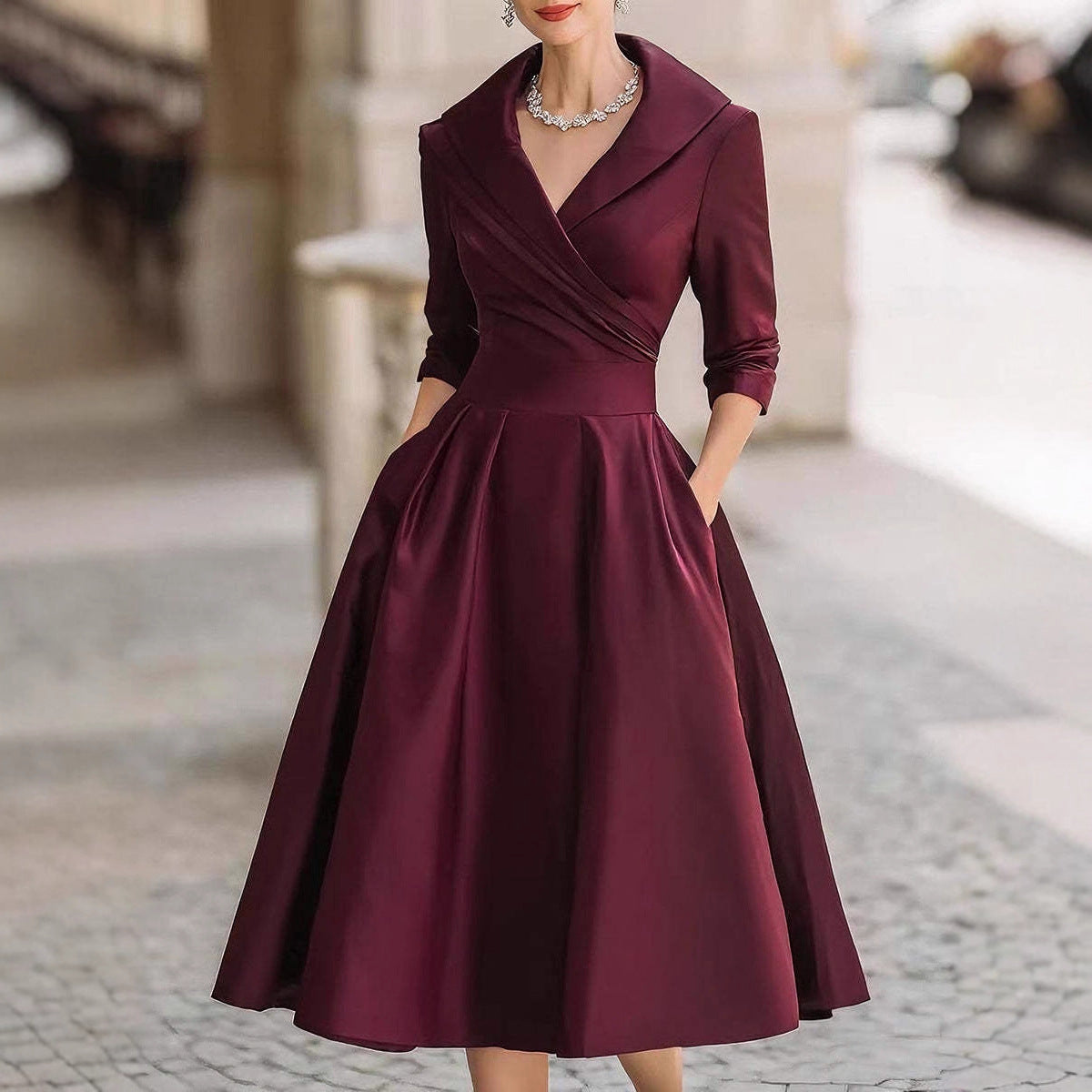 Women’s waist-cinching dress, burgundy, long sleeves, V-neck, full A-line skirt.