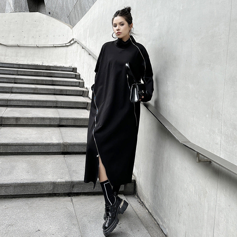 Black knit midi dress with high funnel neck, asymmetrical zipper detail and front slit