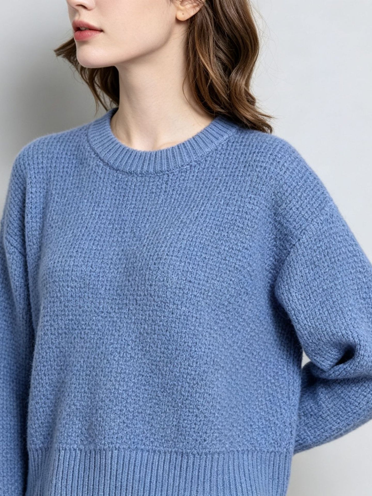 Blue knit pullover sweater with crew round neck, long sleeves, ribbed cuffs and hem