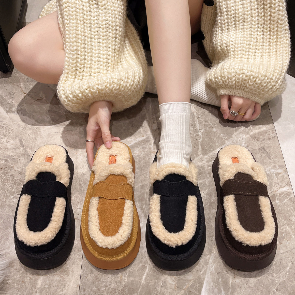 Fur-lined platform slip-on clogs with back strap, three colors shown on the floor