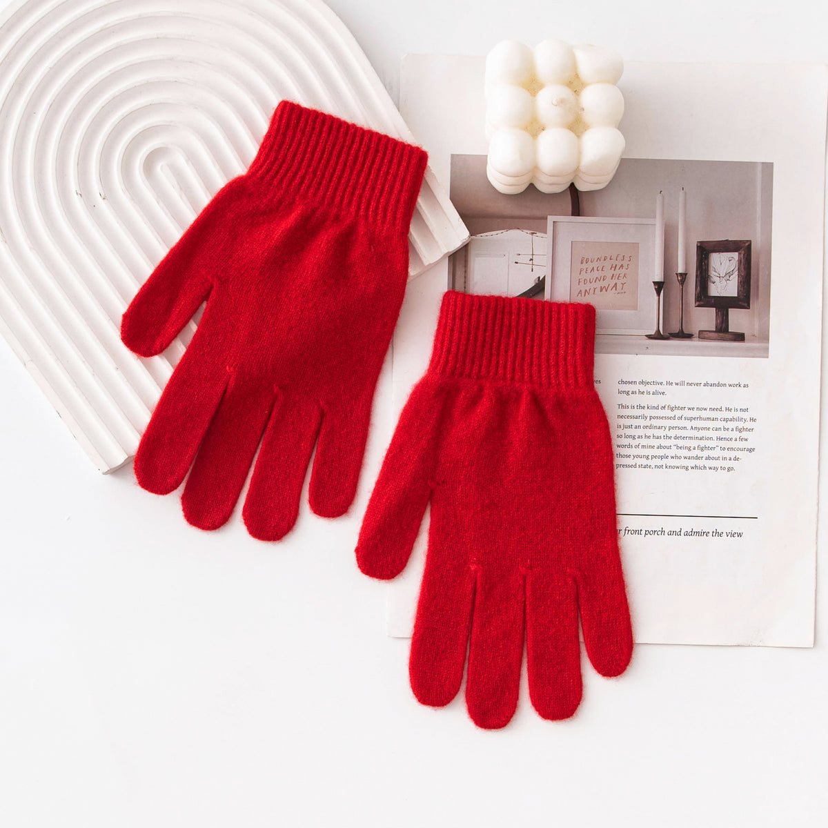 Bright red knitted gloves with ribbed cuffs and full-finger coverage.