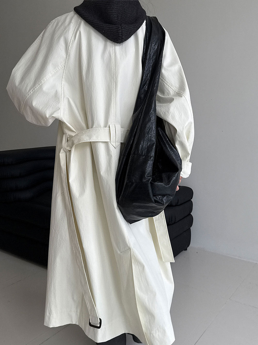Women’s white long lapel trench coat with belt tie waist and button front