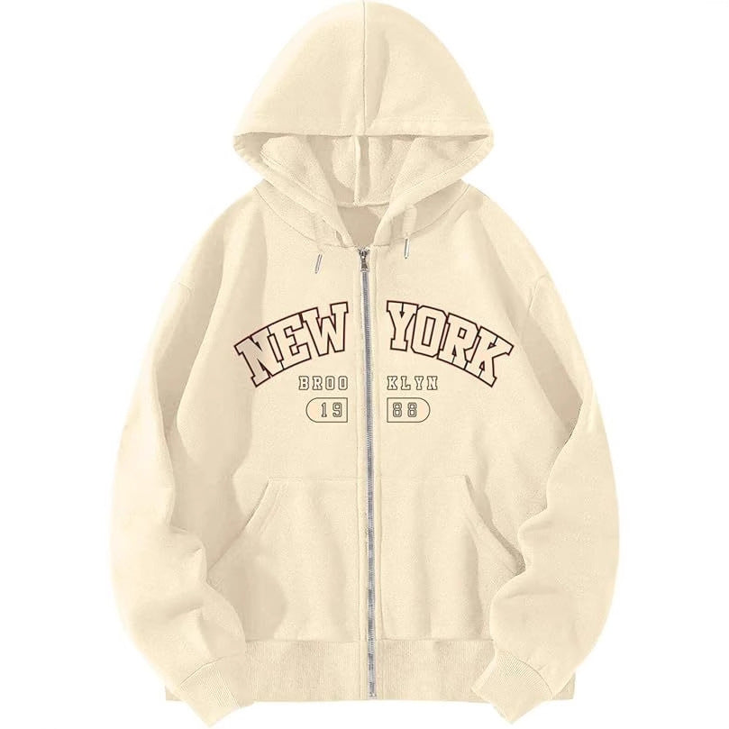 Cream zip-up hooded sweatshirt with NEW YORK and Bklyn graphic, front pockets