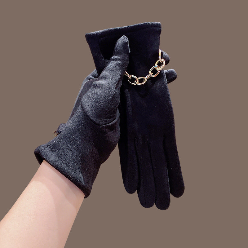 Women’s suede winter gloves, dark color, five-finger style with gold chain cuff detail.