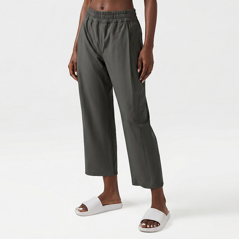 Women’s wide-leg sweatpants with elastic waistband, dark gray fabric, side pocket on leg.