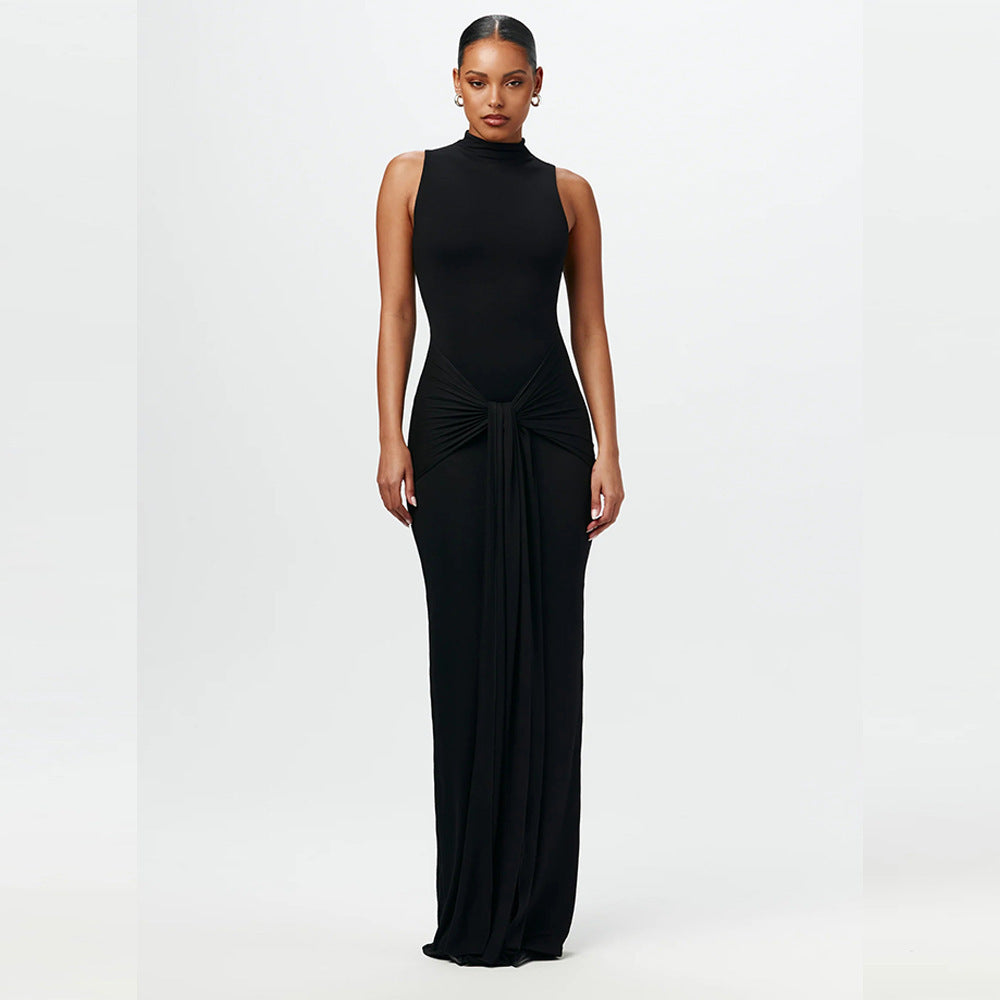 Black sleeveless maxi dress with mock neck and draped waist bow