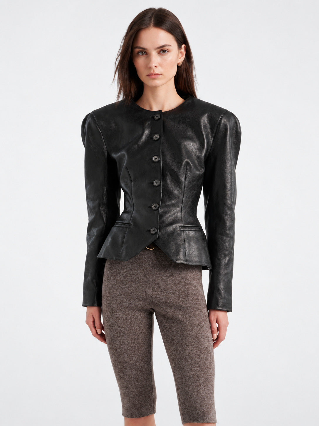 Women’s black leather jacket with button front and peplum waist detail, slim fit.