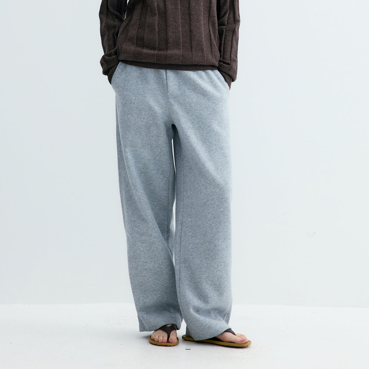 Light gray knit sweatpants with straight wide legs and elastic waistband