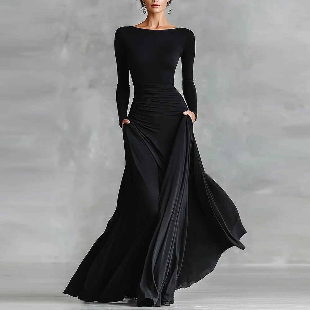 Black long-sleeve mermaid maxi dress with ruched waist and flowing draped skirt, full front