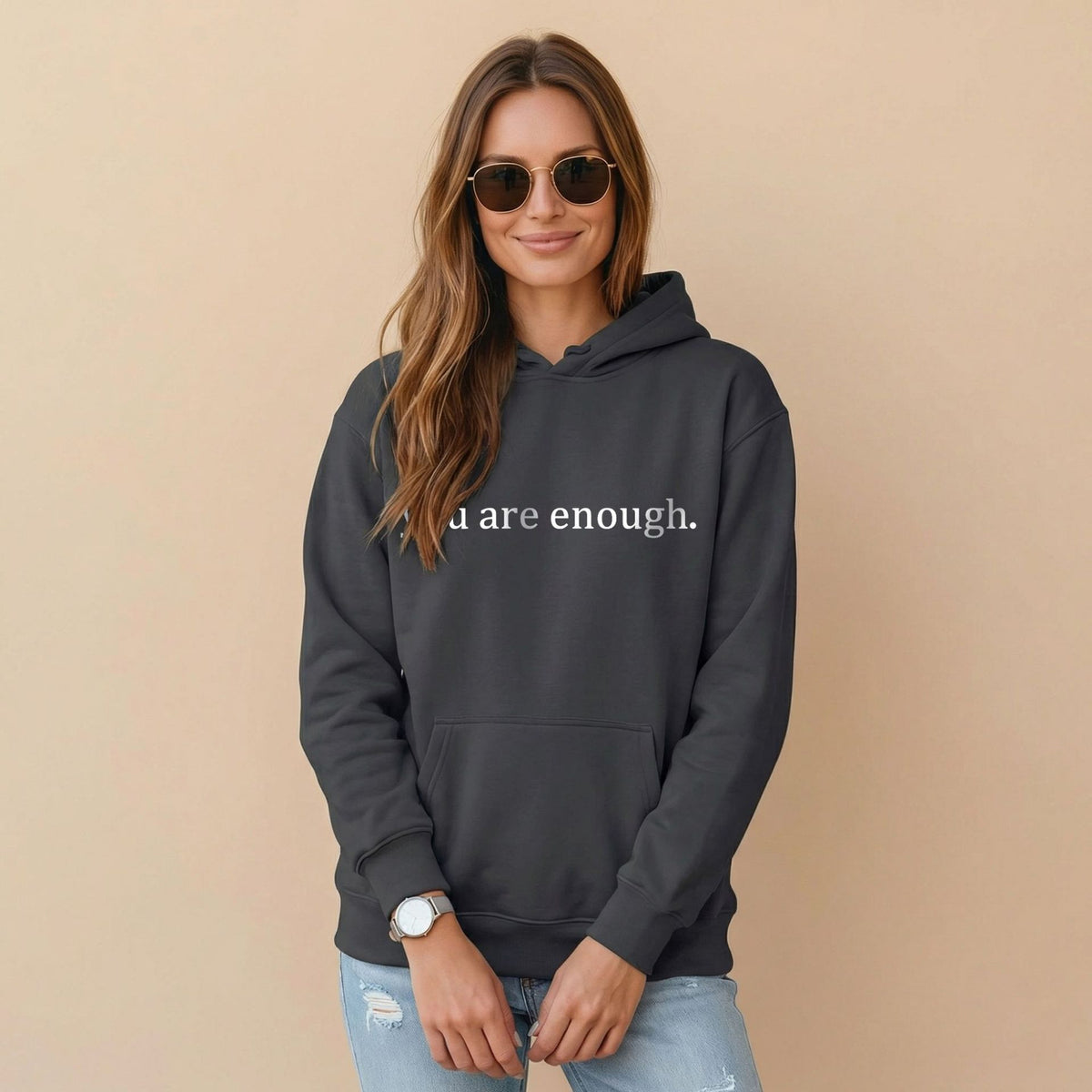 Dark gray women’s hoodie sweatshirt with hood, front pocket, and 'you are enough' print.